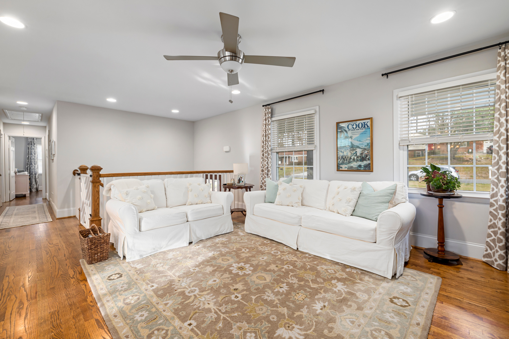 A Living Room with Carpet on a Wooden Floor